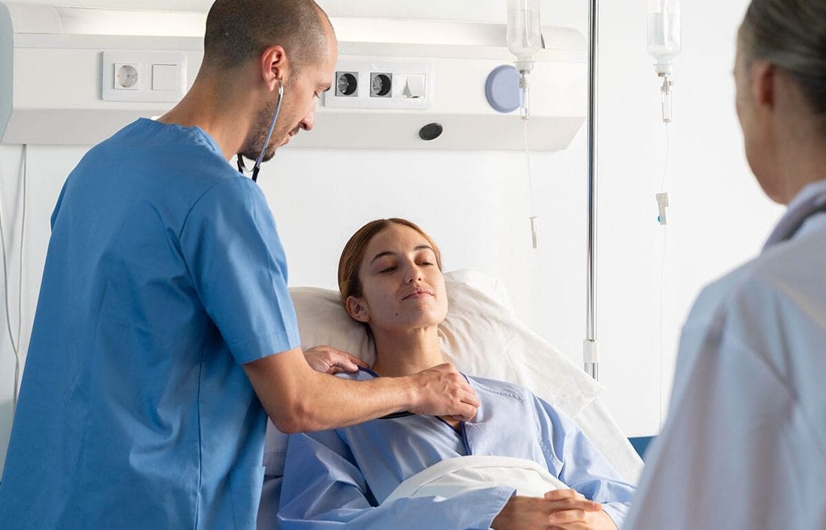 Doctor examining female patient.