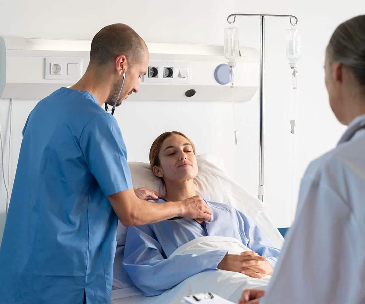 Doctor examining female patient.
