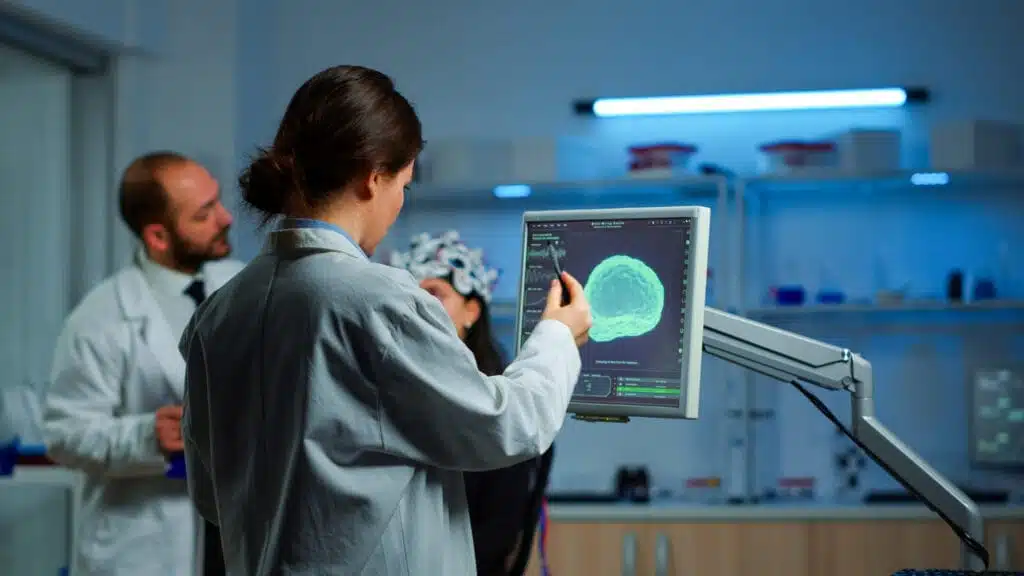 Neurologists analyzing brain scan