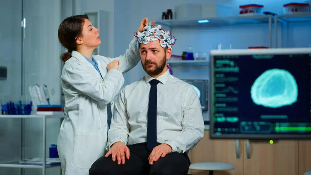 Neurologist examining male patient